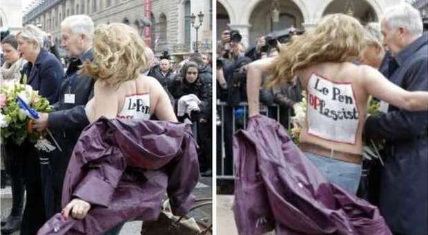 Marine Le Pen contestata dalle Femen a seno nudo: il servizio d'ordine le scaraventa a terra
