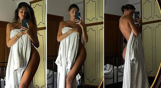 Belen Rodriguez, sexy siparietto estivo: col "calor" l'asciugamano scivola via...