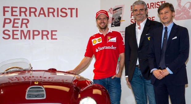 da sinistra il pilota del Cavallino Sebastian Vettel, il team principal della Scuderia Ferrari Maurizio Arrivabene ed il chief brand officer di Ferrari Luca Fuso