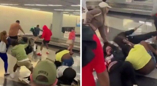 Rissa in aeroporto al nastro bagagli di Chicago, scoppia il caos tra i passeggeri: il video è virale