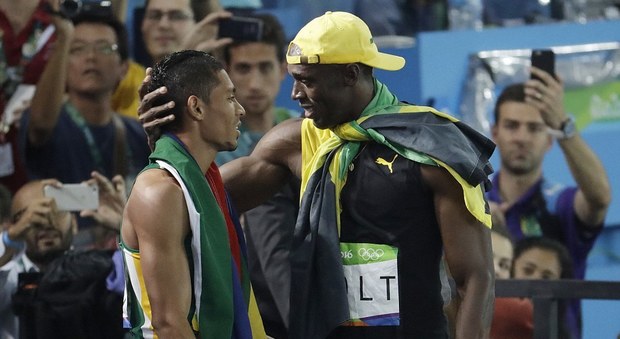 van Niekerk con Usain Bolt