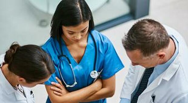 Shot of a group of medical practitioners analysing patient files together in a hospital