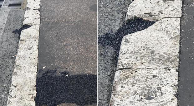 Roma, il bitume per i rattoppi sul marciapiede utilizzato anche per riparare i cordoli di marmo