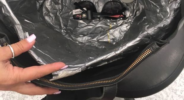 La borsa schermata abbandonata dalla ladra in fuga dal negozio di occhiali a Pradamano
