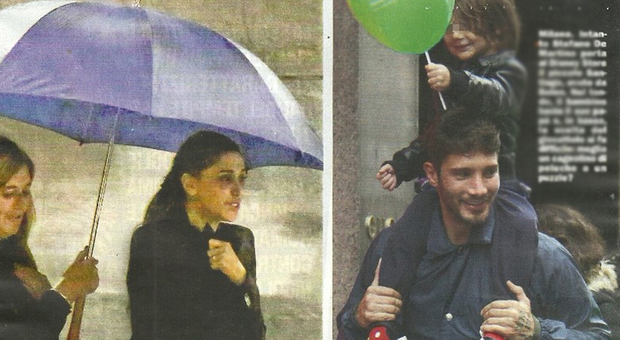 Belen Rodriguez e Andrea Iannone sotto la pioggia a Milano