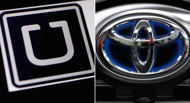 I simboli delle due società: Uber (a sinistra) e Toyota
