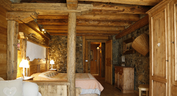Una delle case tipiche in legno dell'Albergo Diffuso Zoncolan