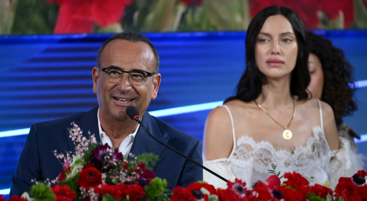 https://statics.cedscdn.it/photos/MED_HIGH/2026/02/26/9383579_26132805_sanremo_conferenza_stampa_conti_share_no_merito_mio_irina_shayk_gianluca_gazzoli.jpg