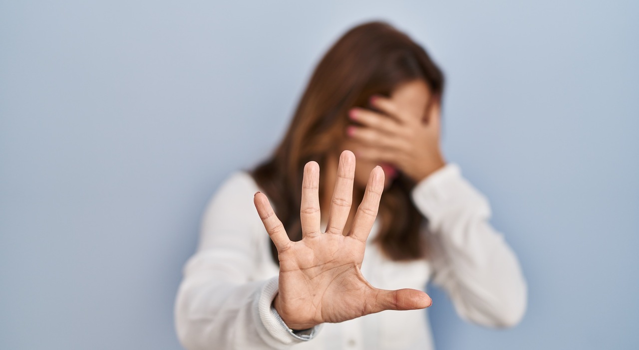 https://statics.cedscdn.it/photos/MED_HIGH/2026/07/03/9629922_03132911_hispanic_woman_standing_isolated_background_covering_eyes_with_hands_doing_stop_gesture_with_sad_fear_expression_embarrassed_negative_concept.jpg