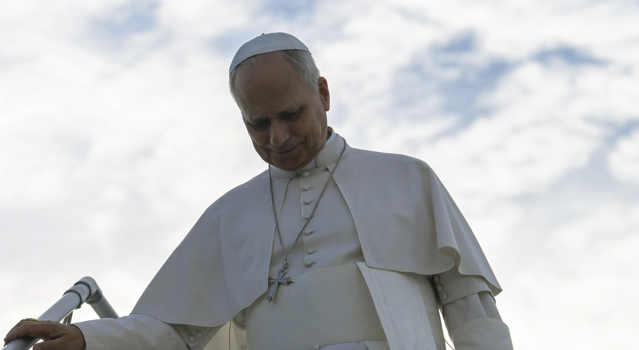 Faithful attached to the traditional Mass in procession toward St Peter's Basilica in Rome.