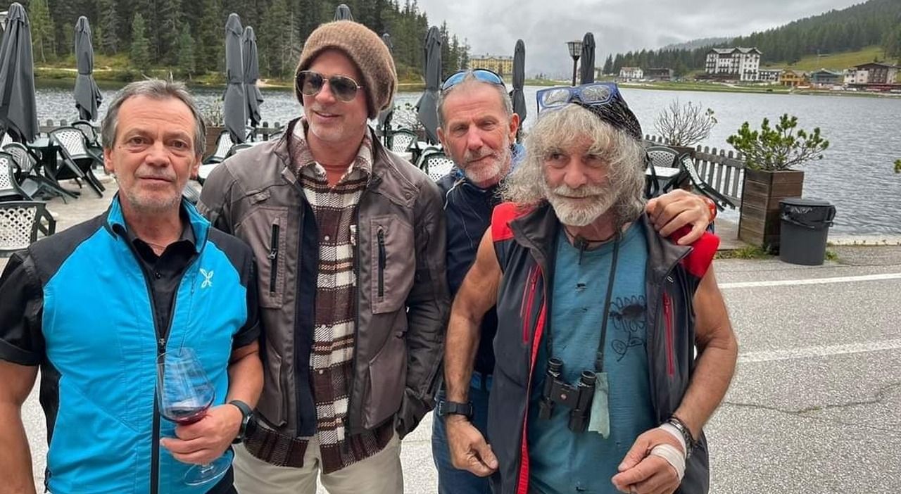 Brad Pitt and Mauro Corona with Misurina.  Hollywood star riding his motorcycle in the Dolomites