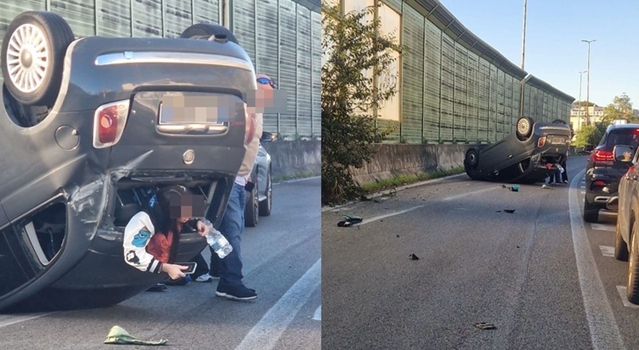 Lunotto posteriore sfondato da una ragazza che si mette in salvo.