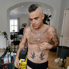 Robbie Williams e la missione umanitaria: «Ho rischiato di essere decapitato»
